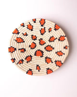 Leopard print Sabai grass wall plate or basket with orange and black threadwork