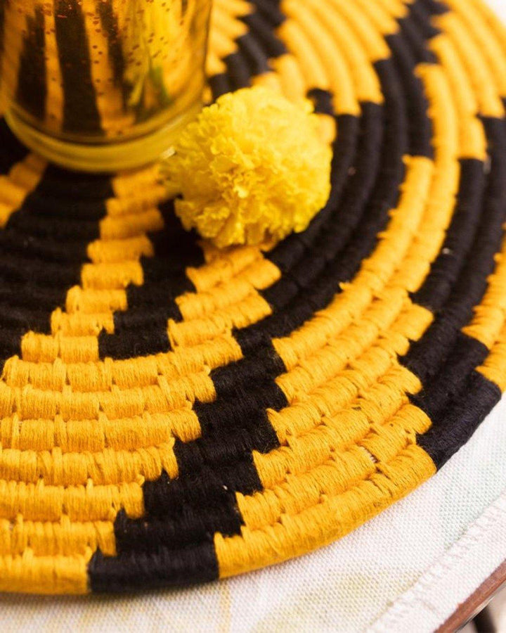 Details of Tiger stripe sabai placemat with yellow and black threadwork