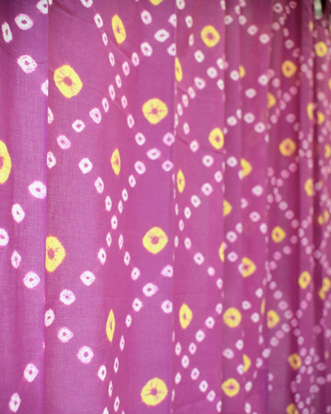 Details of purple and yellow bandhani fabric or curtain