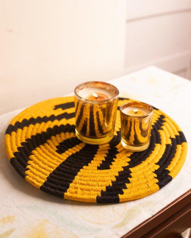 Tiger stripe print Sabai placemat with gold candle votives