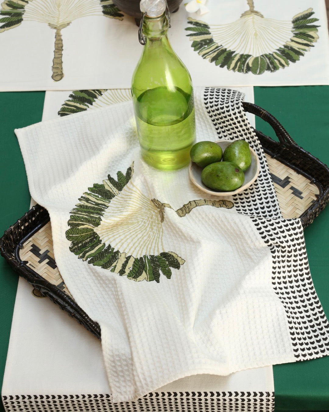 Traveller's palm tea towel with raw mangoes