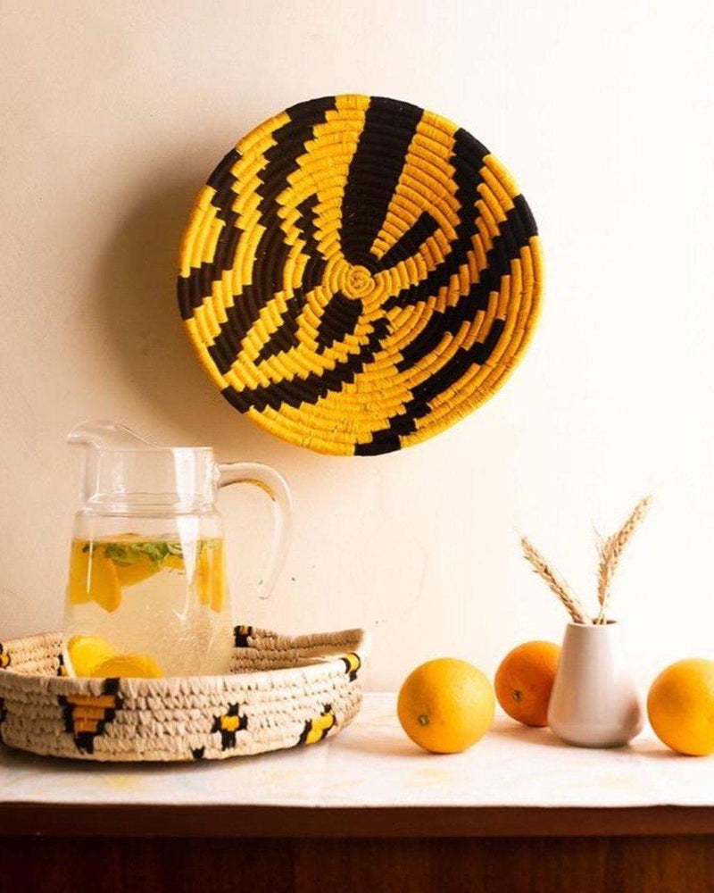 Animal print Tiger stripe Sabai grass wall plate or basket with a jug and oranges