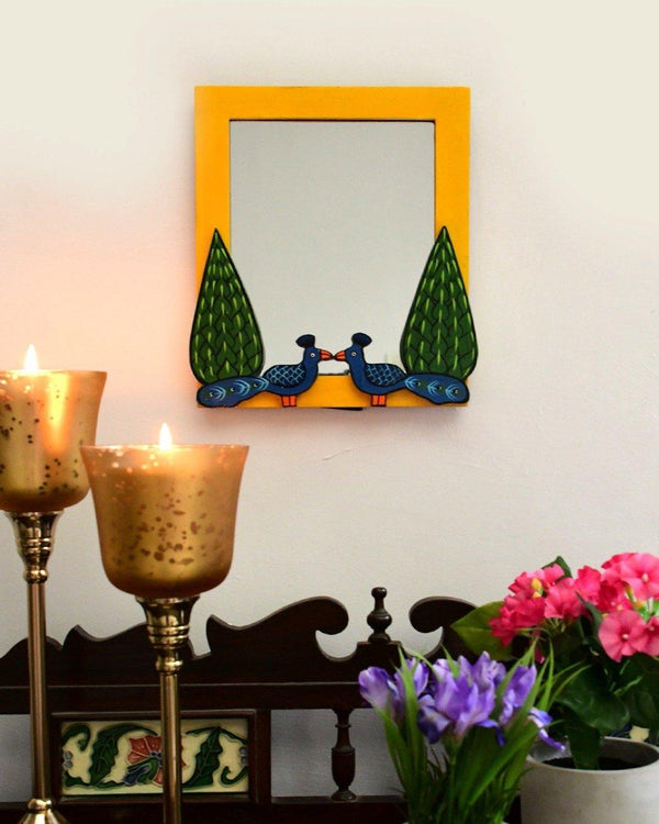 Peacock and Cypress mirror mounted on wall