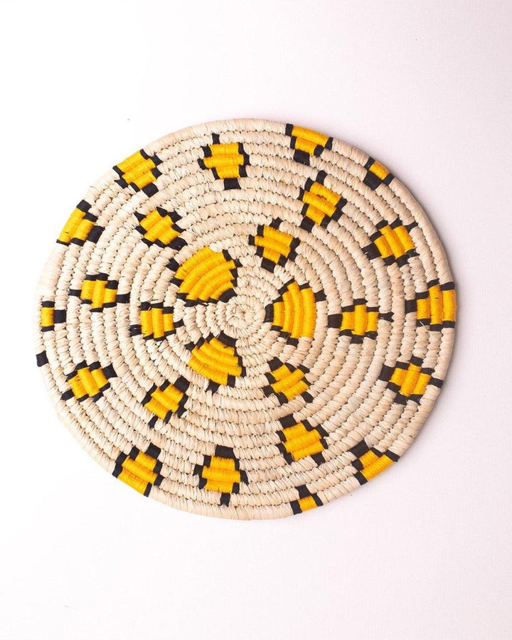Leopard print handwoven Sabai grass placemat with yellow and black threadwork